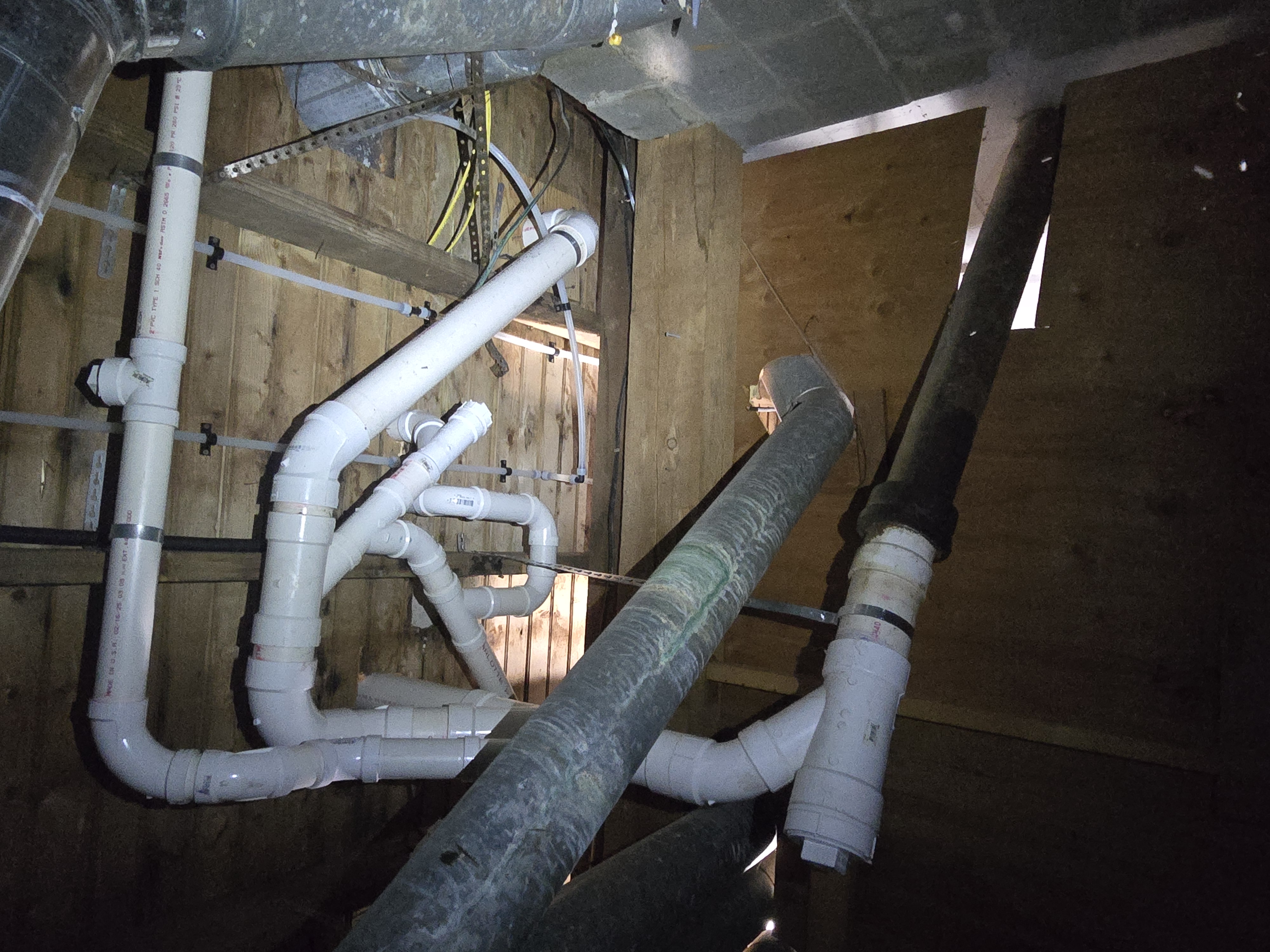 Rough plumbing tie-in, PVC and cast iron stack