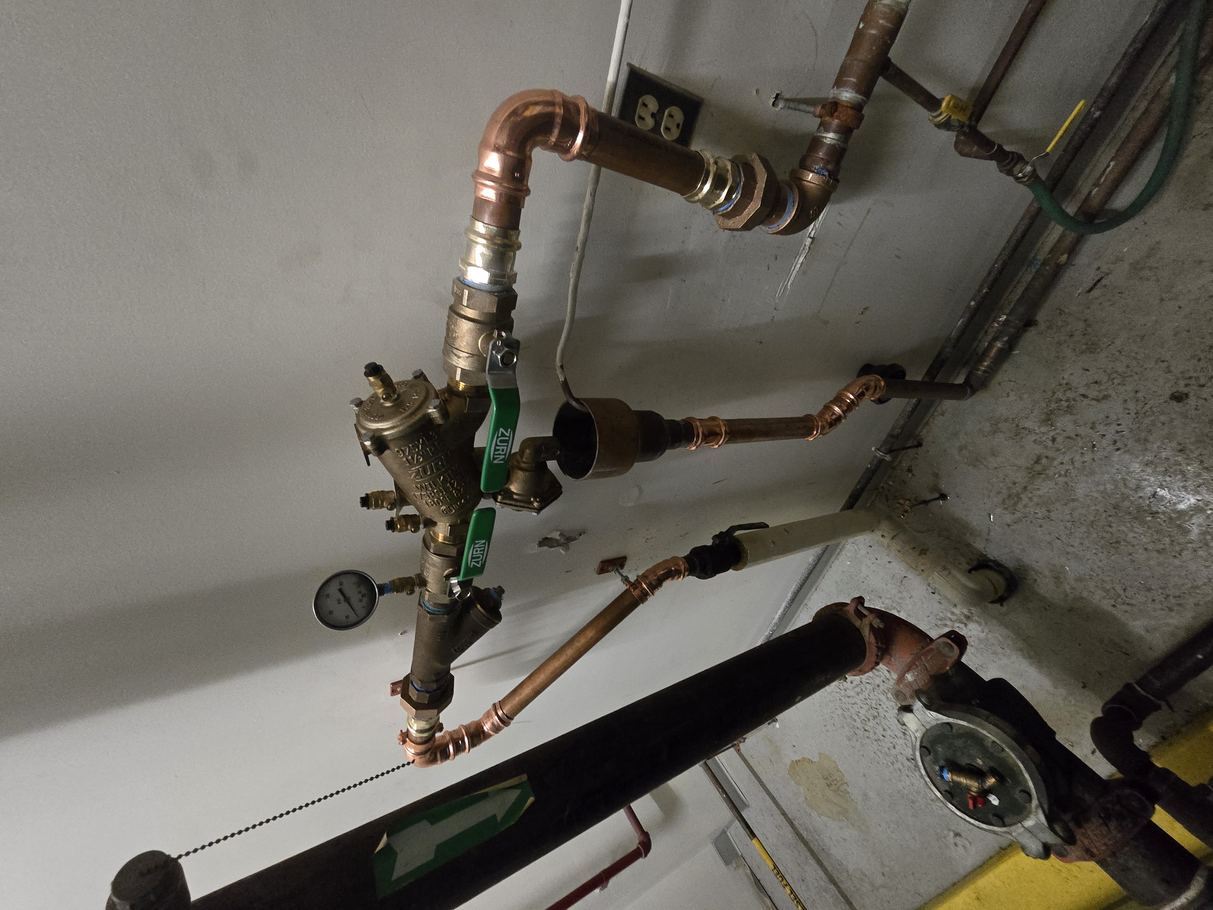 Backflow preventer and pressure-reducing valve assembly